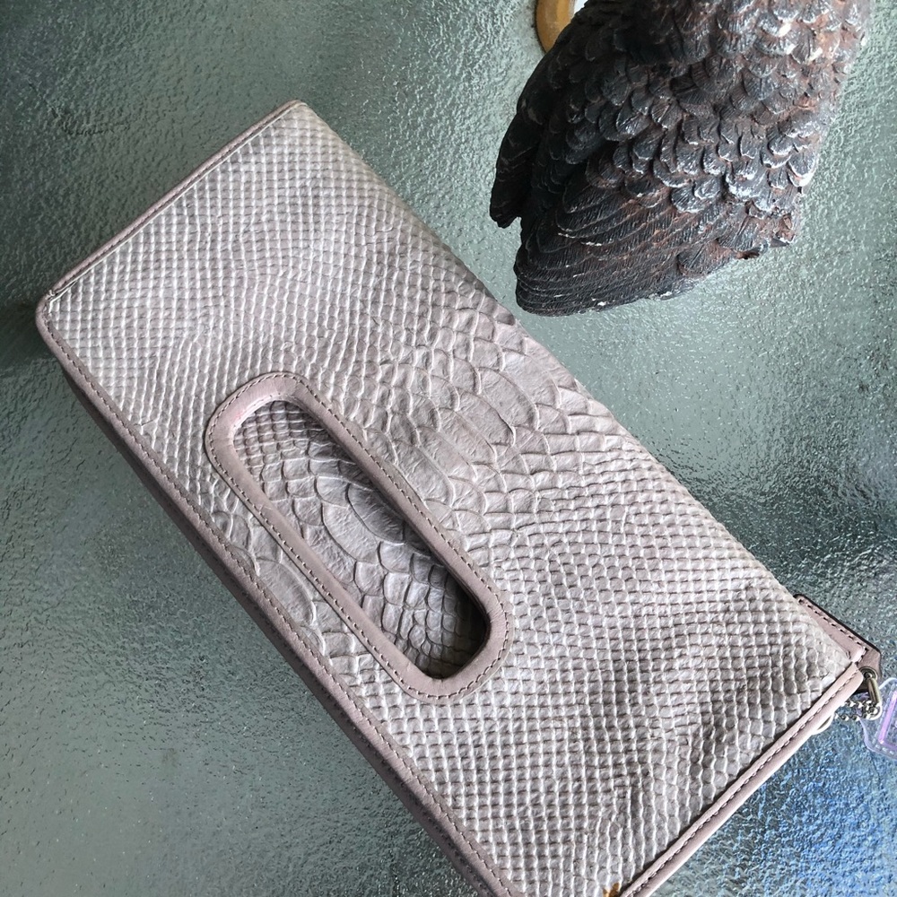 Pink and purple coach clutch